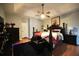 Main bedroom with a king-size bed, dark wood furniture, and ceiling fan at 123 Hollow Springs Dr, Hiram, GA 30141