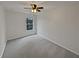 Spacious bedroom with neutral walls and carpeted floor at 1710 Garbrooke Cv, Lawrenceville, GA 30046