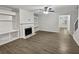 Bright living room featuring hardwood floors and fireplace at 1710 Garbrooke Cv, Lawrenceville, GA 30046