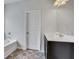 Bathroom with garden tub and dark brown vanity at 204 Hickory Commons Way, Canton, GA 30115