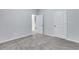 Spacious bedroom with gray carpet and access to another room at 204 Hickory Commons Way, Canton, GA 30115