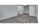 Spacious bedroom with gray carpet and neutral walls at 204 Hickory Commons Way, Canton, GA 30115