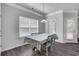 Dining area with light gray walls, wood-look floors, and access to patio at 204 Hickory Commons Way, Canton, GA 30115