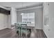 Bright dining area with light gray walls and wood-look flooring at 204 Hickory Commons Way, Canton, GA 30115