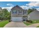 Two-story house with garage at 204 Hickory Commons Way, Canton, GA 30115