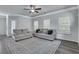 Spacious living room with gray walls, wood-look flooring, and neutral-toned furniture at 204 Hickory Commons Way, Canton, GA 30115