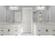 Elegant bathroom featuring double vanities and a large mirror at 3170 Old Hwy 92 Dr, Acworth, GA 30102