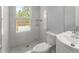 Modern bathroom with white vanity, toilet and pebble floor shower at 3170 Old Hwy 92 Dr, Acworth, GA 30102