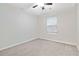 Spacious bedroom with ceiling fan and neutral carpeting at 6397 Barker Station Walk, Sugar Hill, GA 30518