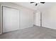 Bedroom with double-door closet and ceiling fan at 6397 Barker Station Walk, Sugar Hill, GA 30518