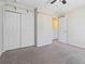 Bright bedroom featuring a double door closet and ceiling fan at 6397 Barker Station Walk, Sugar Hill, GA 30518