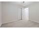 Bedroom with double door closet and access to hall bath at 6397 Barker Station Walk, Sugar Hill, GA 30518