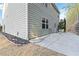 Side view of a gray house showing exterior and patio at 6397 Barker Station Walk, Sugar Hill, GA 30518