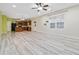 Open living room and kitchen with light wood-look flooring at 6397 Barker Station Walk, Sugar Hill, GA 30518