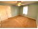 Light blue walls and tan carpet in this spacious bedroom at 891 Daniell Se Dr, Smyrna, GA 30080