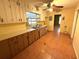 Long kitchen with light brown cabinets and tiled floor at 891 Daniell Se Dr, Smyrna, GA 30080