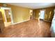 Bright living room with laminate flooring and multiple entrances at 891 Daniell Se Dr, Smyrna, GA 30080