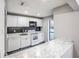 White kitchen with modern appliances and granite countertops at 3948 Cedar Cir, Tucker, GA 30084