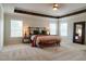 Spacious main bedroom with high ceilings, large windows, and a cozy sitting area at 121 Treeline Trl, Canton, GA 30115