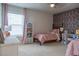 Twin bedroom with mushroom wallpaper and built-in desk at 121 Treeline Trl, Canton, GA 30115