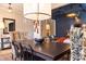 Formal dining room with dark wood table, patterned chairs, and statement light fixture at 121 Treeline Trl, Canton, GA 30115