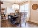 Elegant dining room with hardwood floors, large window, and statement lighting at 121 Treeline Trl, Canton, GA 30115