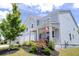 Two story house with light blue siding, front porch, and manicured landscaping at 121 Treeline Trl, Canton, GA 30115