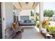 Relaxing front porch with a swing and seating area at 121 Treeline Trl, Canton, GA 30115