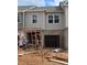 Townhome exterior features gray siding and brick foundation at 2804 Lillian Ln, Douglasville, GA 30135
