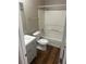 Bathroom with a tub, toilet, and gray vanity at 3575 Oakvale Falls Ct, Decatur, GA 30034