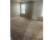 Large carpeted bedroom with neutral walls and window at 3575 Oakvale Falls Ct, Decatur, GA 30034