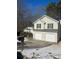 Two-story house with a two-car garage and snow-covered driveway at 3575 Oakvale Falls Ct, Decatur, GA 30034