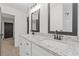 Modern bathroom with double vanity and granite countertop at 4045 White Oak Sw Ln, Lilburn, GA 30047