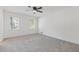 Well-lit bedroom with ceiling fan and carpet at 4045 White Oak Sw Ln, Lilburn, GA 30047