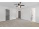 Spacious bedroom with carpet and two doors at 4045 White Oak Sw Ln, Lilburn, GA 30047