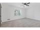 Bright bedroom featuring carpet and large window at 4045 White Oak Sw Ln, Lilburn, GA 30047