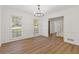 Bright dining room with hardwood floors and access to the hallway at 4045 White Oak Sw Ln, Lilburn, GA 30047