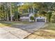 Two-story house with gray shutters and a spacious lawn at 4045 White Oak Sw Ln, Lilburn, GA 30047