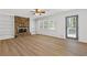 Living room features hardwood floors and a stone fireplace at 4045 White Oak Sw Ln, Lilburn, GA 30047