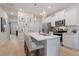 Modern kitchen with white cabinets and island at 451 Payne Dr, Mcdonough, GA 30253