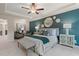 Spacious main bedroom with sitting area and dark teal accent wall at 451 Payne Dr, Mcdonough, GA 30253