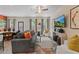 Bright living room featuring stylish furniture, a ceiling fan, and a view into the dining area at 455 Payne Dr, Mcdonough, GA 30253