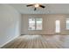 Bright and airy living room with hardwood floors and sliding door access to backyard at 455 Payne Dr, Mcdonough, GA 30253