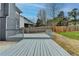 Grey deck with view of homes and trees at 5102 Anclote Dr, Alpharetta, GA 30022