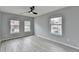 Bright bedroom with ceiling fan and laminate wood floor at 5102 Anclote Dr, Alpharetta, GA 30022