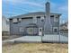 Gray house back exterior with deck and fenced yard at 5102 Anclote Dr, Alpharetta, GA 30022