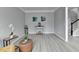 Living room with gray walls, wood-look floors, and a coffee table at 5102 Anclote Dr, Alpharetta, GA 30022