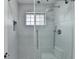 Updated shower with glass enclosure and modern fixtures at 5102 Anclote Dr, Alpharetta, GA 30022