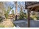 Backyard featuring a wooden fence, mature trees, and scenic views of the surrounding landscape at 160 Vanira Se Ave # A, Atlanta, GA 30315
