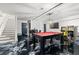 This finished basement features a game room with a pool table, arcade games, and a bar at 160 Vanira Se Ave # A, Atlanta, GA 30315